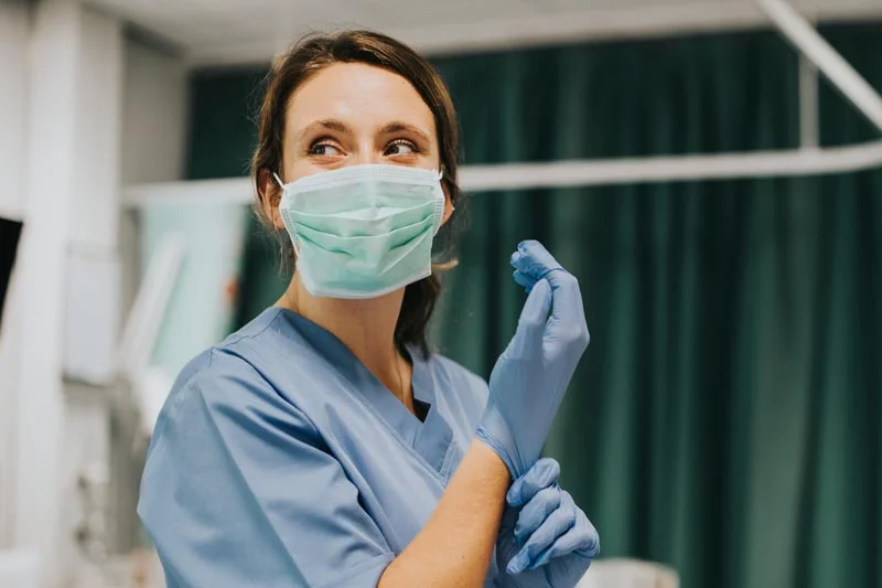 Doctor wearing a mask and gloves